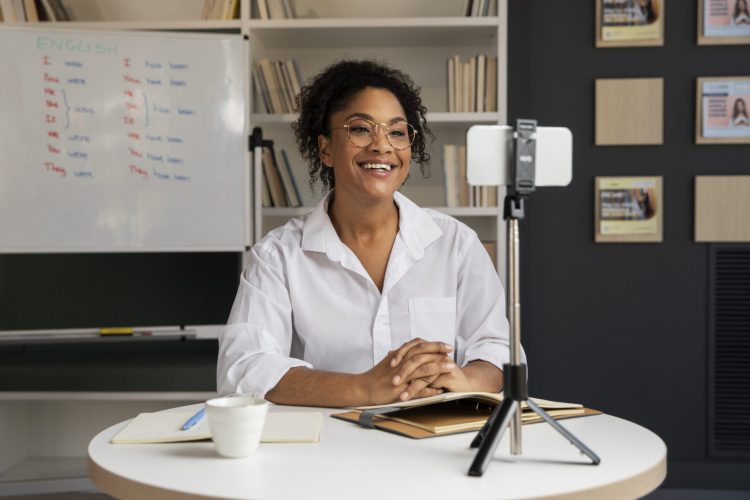 medium-shot-smiley-woman-recording-herself (1)